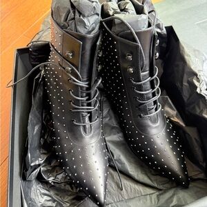 Saint Laurent Black Lace Up Boots with Polished Leather and Intricate Detailing